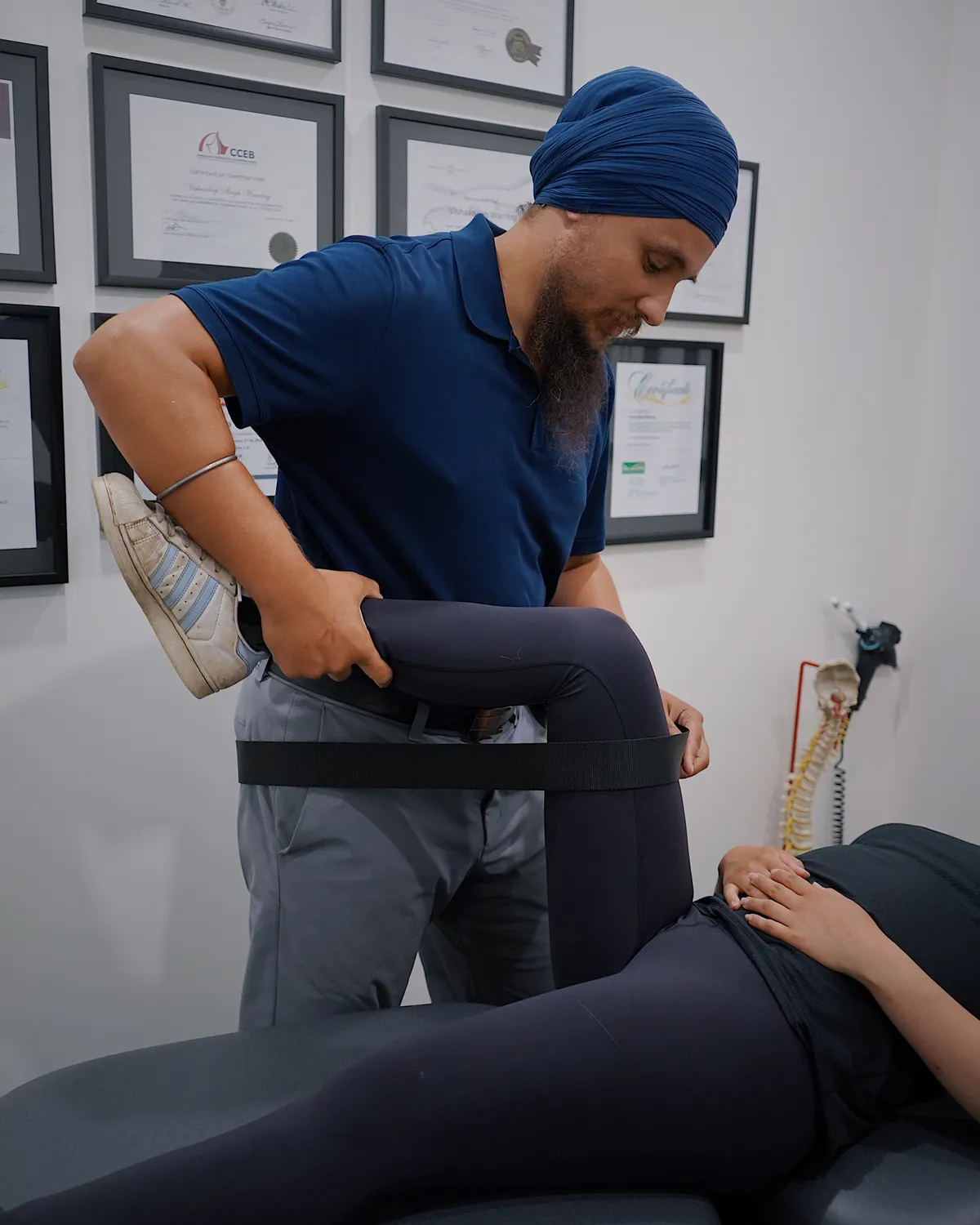 Physiotherapist guiding a patient through a one-on-one rehabilitation exercise