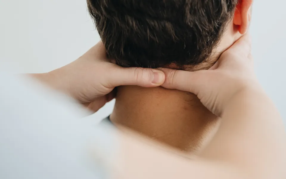 Therapist treating a patient's neck after a car accident